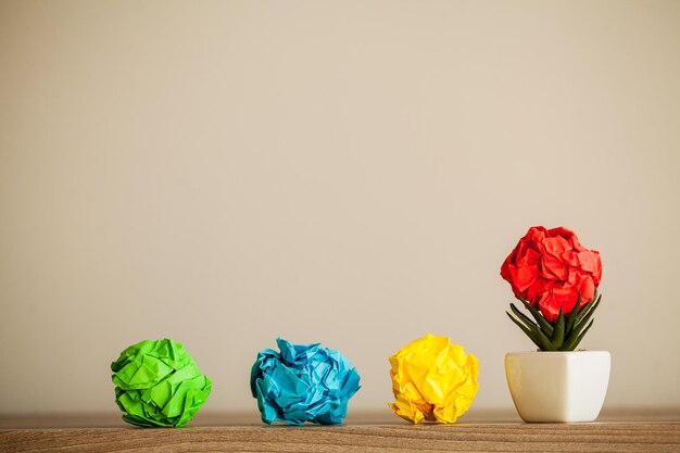 Crumpled paper balls on wood background