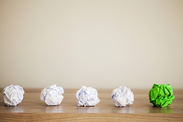 Crumpled Paper balls on wood surface