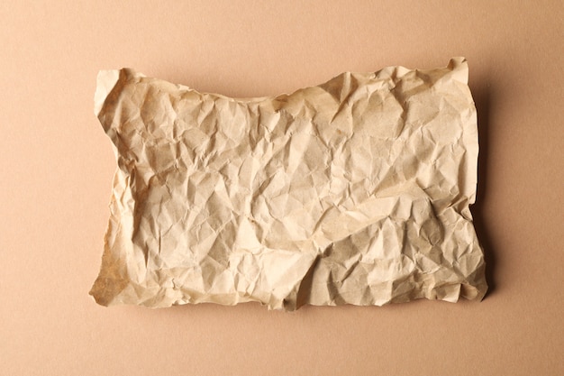 Crumpled paper on craft, top view