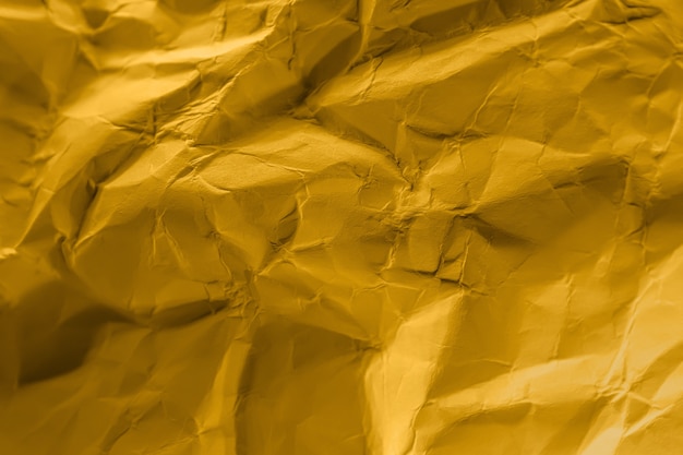 Фото Мятая бумага пастельных тонов fortune gold. абстрактные тенденции фонового изображения.