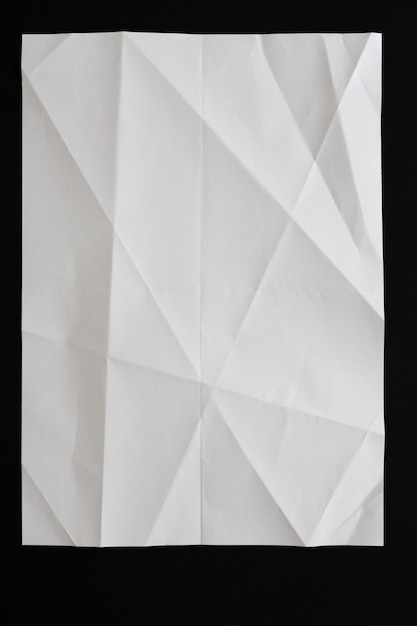 Crumpled paper isolated on black