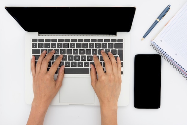 Crumpled paper, notebook, computer and pencil