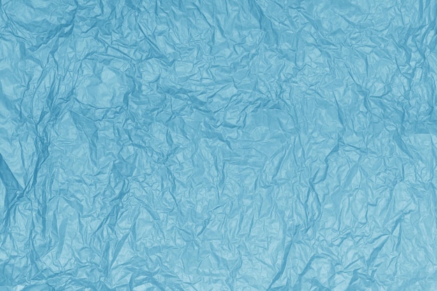 Crumpled paper texture or abstract blue background