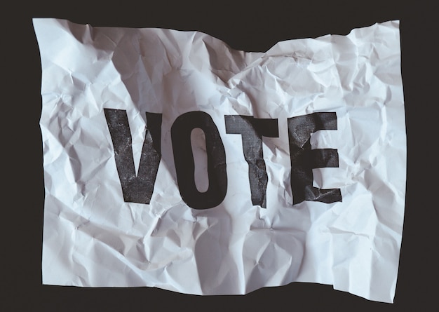 Crumpled paper withÃÂ word vote printed,ÃÂ collapse of democracy concept