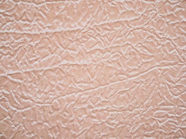 Crumpled pink fabric texture table