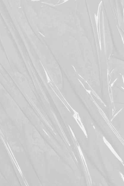 Photo crumpled plastic warp grunge plastic wrap on white background texture transparent stretched film polyethylene