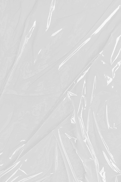 Crumpled plastic warp Grunge plastic wrap on white background Texture transparent stretched film polyethylene