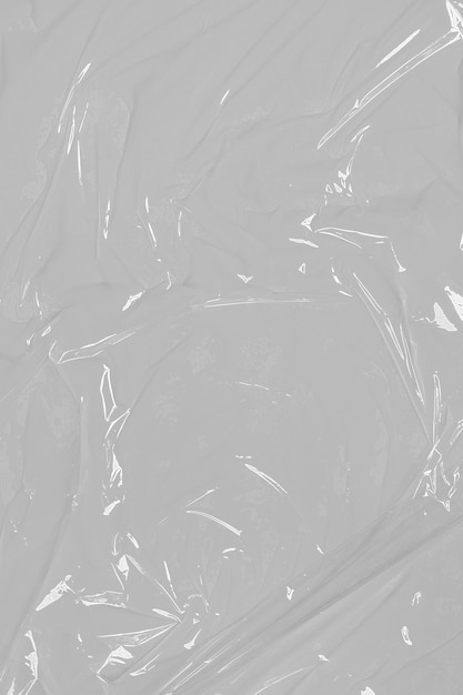 Plastica arrugginita grunge su sfondo bianco texture pellicola trasparente polietilene allungato
