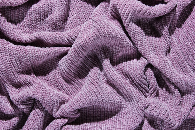 Crumpled purple knitted sweater