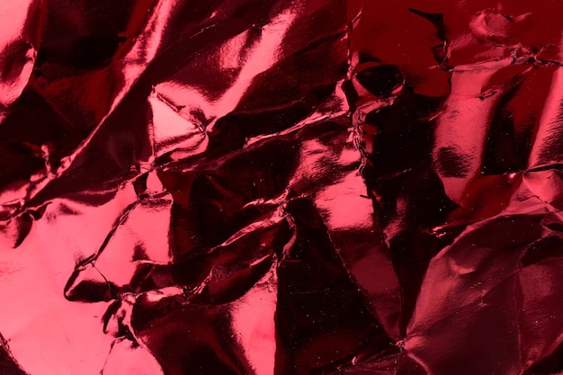 Crumpled red foil paper texture