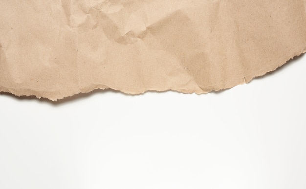 Crumpled sheet of brown wrapping paper isolated