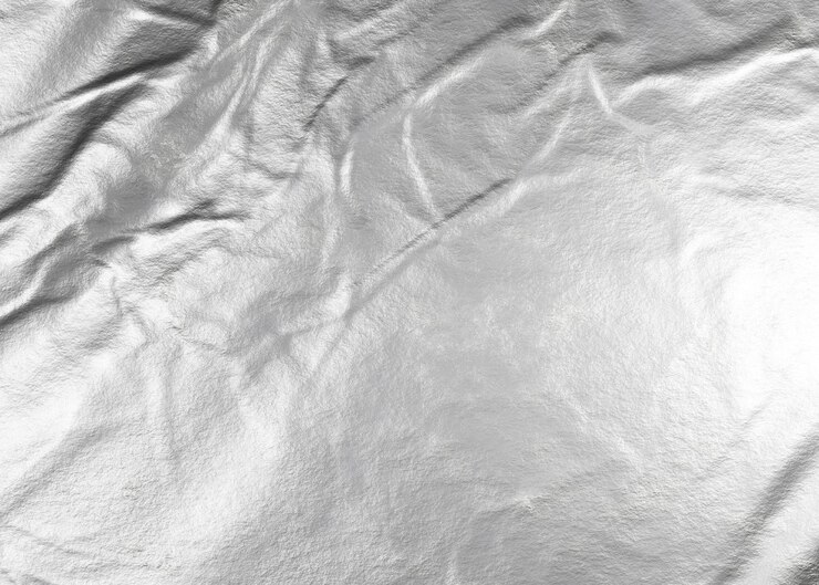 Photo crumpled silver aluminum foil background