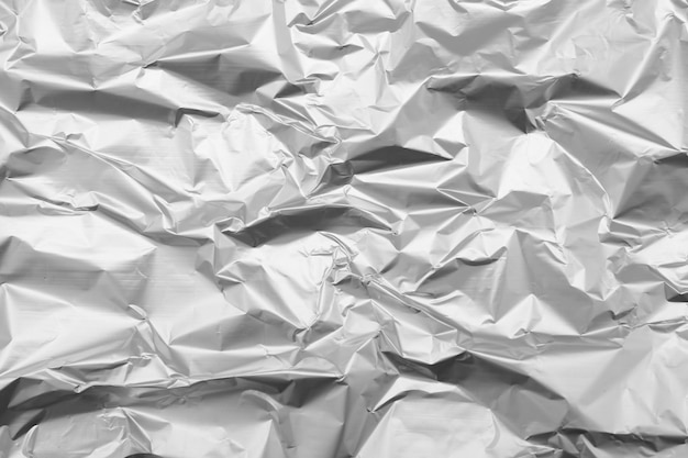 crumpled silver foil as background top view