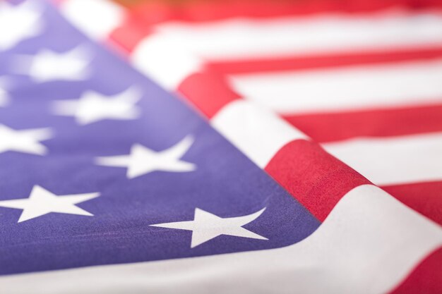 crumpled of United state of America flag with selective focused on star; vintage color effected