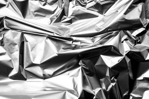 Crumpled up silver foil background