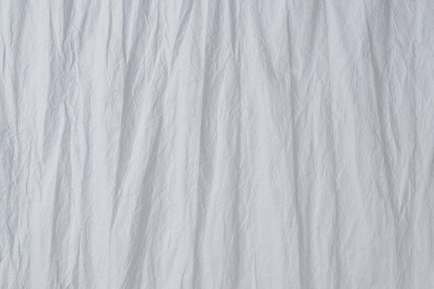 Crumpled white paper background. Top view. Copy space.