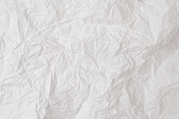 Crumpled white paper background. Top view. Copy space.