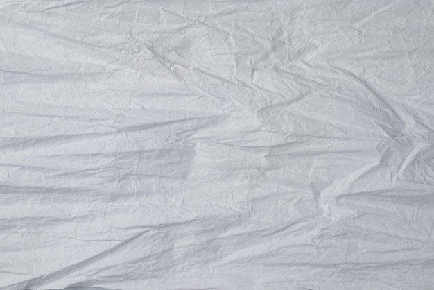 Crumpled white paper background Top view Copy space