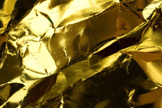 Crumpled yellow gold paper texture