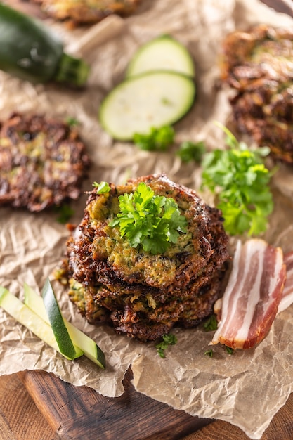 Crunchy zucchini pancakes with bacon parsley herbs and other ingredients.