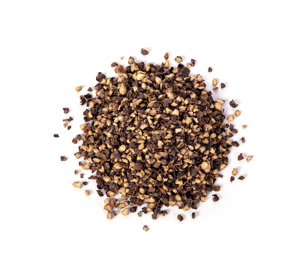 Photo crushed black pepper on whited background. top view