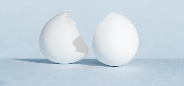 Crushed chicken egg shell on blue background