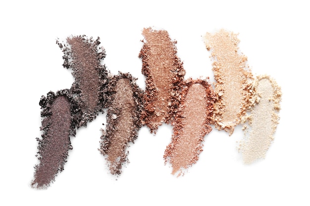 Photo crushed eye shadows on white background professional makeup products