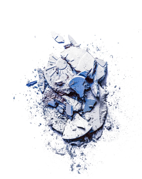 crushed eyeshadows and powder isolated on white background