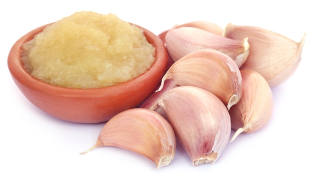 Crushed garlic over white background