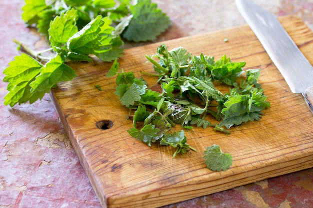 The crushed leaves brewed raw nettles on the kitchen table.