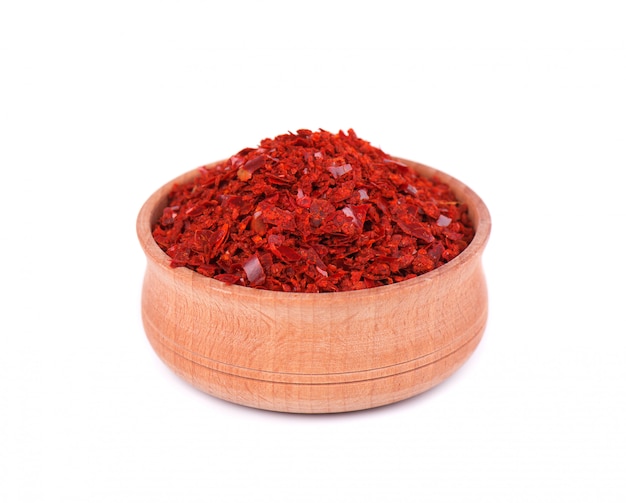 Crushed red cayenne pepper in a wooden bowl