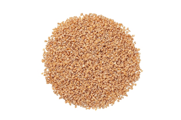 Crushed spelled groats. View from above. White background. Isolated.