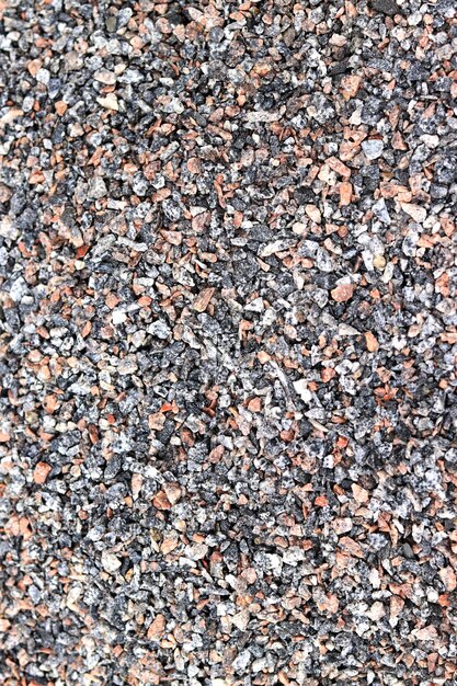 Crushed stone closeup top view Fine granite crushed stone Construction materials background Gravel