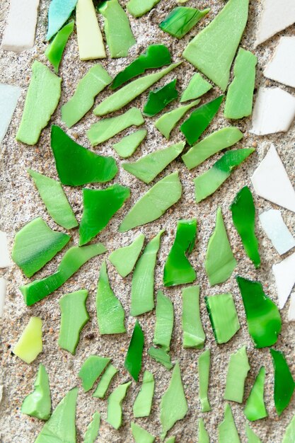 Crushed tile wall in mosaic background close up