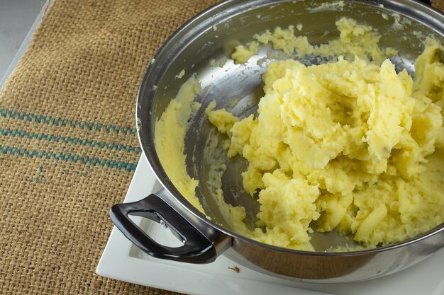 Crushing Boiled Potatoes With A Potato Masher homemade