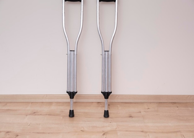 Crutches in front of the wall