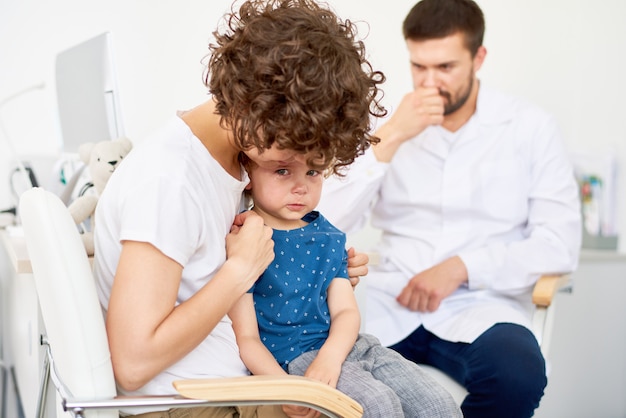 Crying Little Boy in Doctors Office