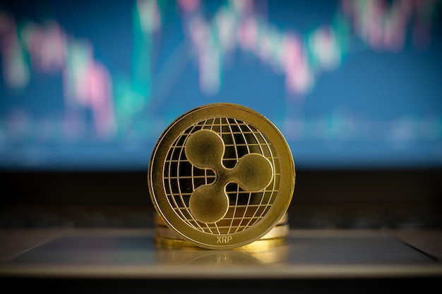 Photo cryptocurrency coin and financial chart in background