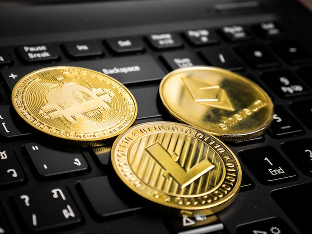 Cryptocurrency coins on the black keyboard.