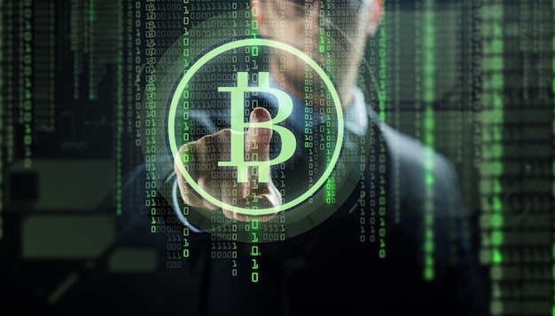 cryptocurrency finance and business concept close up of businessman with virtual bitcoin symbol hologram over and binary code and black background