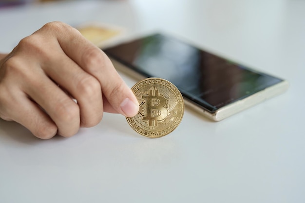 Cryptocurrency is digital currency women hold their hands on computer ready bitcoin coins to invest assets from the digital or imaginary world of the future finance investment risk management