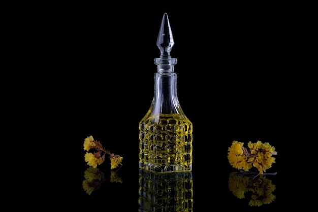 Crystal bottle of vintage perfume on black background