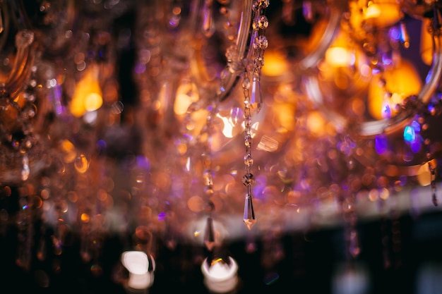 Photo crystal chandelier, close-up photo. crystal chandelier in the interior.