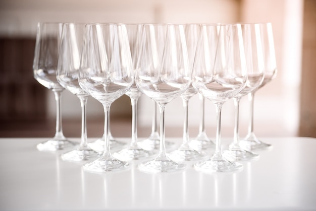 Crystal clear empty wine glasses on a table.