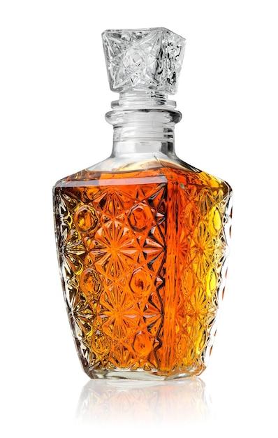 Crystal decanter with cognac isolated on white