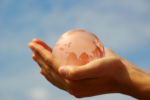 Crystal globe in hands