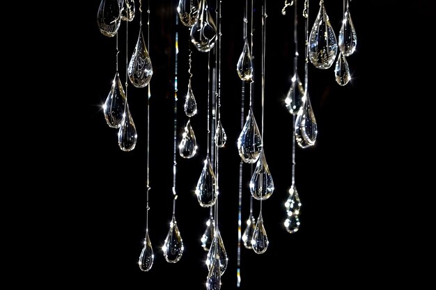 Crystal pendants on dark background with reflective light