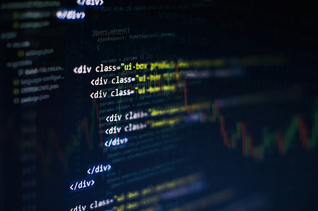 CSS, JavaScript and HTML usage. Monitor closeup of function source code. Abstract IT technology background. Software source code.