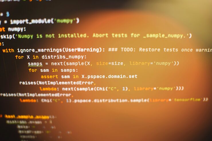 Photo css,javascript和html的使用. 监控功能源代码的近距离. 抽象的it技术背景. 软件源代码.