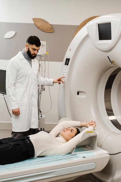 CT scan of abdomen of girl in medical clinic Woman patient is doing computed tomography xray scan chest examination of abdominal in a CT scan room